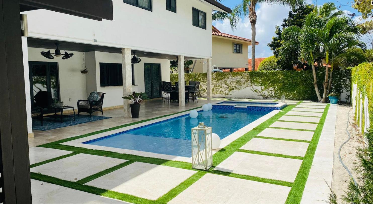 Pool, spa and paver-and-turf patio
